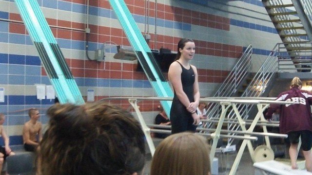 Hellen Moffitt of West Potomac accepts her award for winning the 100 fly in a new regional record time of 54.53. (Photo Courtesy: Matt Rees)