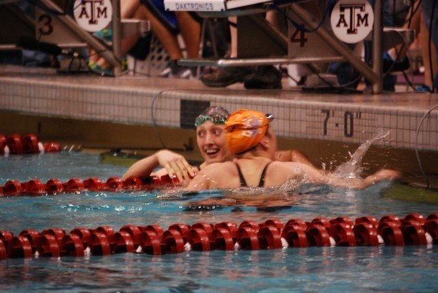 Larson and Tennessee's Molly Hannis, the runner-up, embrace after Larson's 100 breaststroke NCAA Record. Credit: Janna Schulze