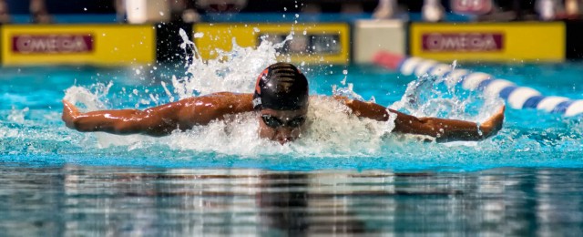 He's Phelps Fast. Justin Lynch broke Michael Phelps 15 -16 national age group record in the 100 fly. (photo: Mike Lewis, Ola Vista Photography)