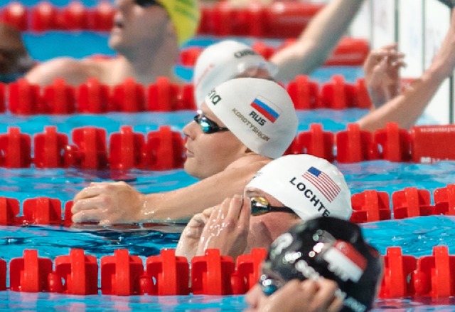 Pawel Korzenionski & Ryan Lochte, 100 butterfly prelim, 2013 FINA Worlds (Photo Credit Victor Puig, victorpuig.com)