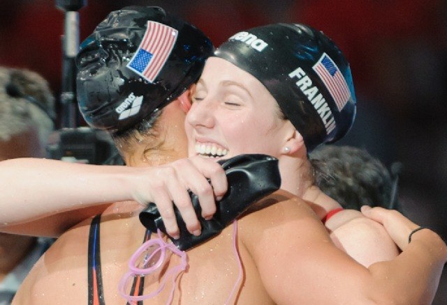 Missy Franklin hugs Megan Romano after winning the women's 4x100 medley relay victory, 2013 FINA World Championships (Photo Credit: Victor Puig)