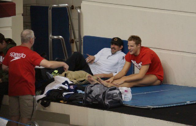 Michael Phelps at the 2013 Arena Grand Prix in Minnesota helping out his NBAC swimmers (courtesy of TakeItLive)