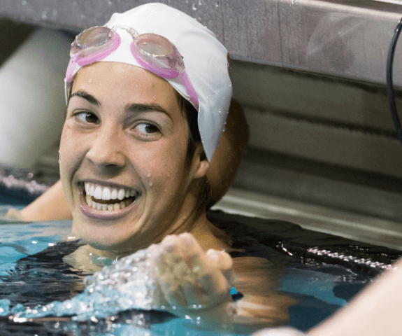 Maya DiRado is all smiles afer her 400 IM win (plus 200 IM win from day 1) at the 2014 NCAA Women's DI Swimming & Diving Championships (Tim Binning, theswimpictures)