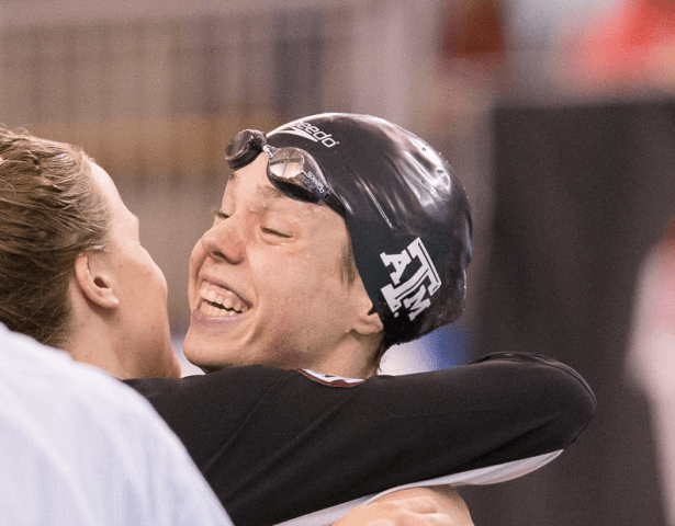 Paige Miller, Texas A&M, wins the 100 backstroke at the 2014 NCAA Women's DI Swimming & Diving Championships (Tim Binning, theswimpictures)
