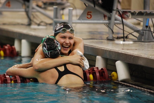 Olivia Smoliga celebrates with teammate Maddie Locus after winning the 50 free. (Photo Courtesy: Janna Schulze)