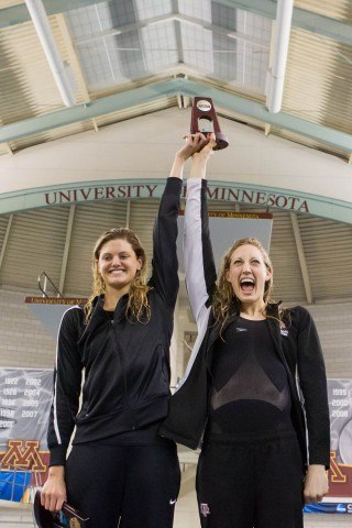 Texas A&M Senior Breeja Larson ® and Sophomore Ashley McGregor (L) celebrate a 2-4 finish for the Aggies in the 200 breaststroke at the 2014 Women's NCAA DI Swimming & Diving Championships (courtesy of Tim Binning, the swim pictures)
