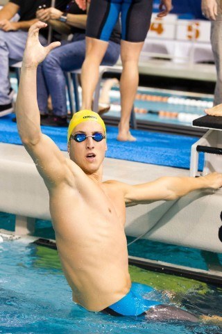 Cal 200 medley relay anchor Tyler Messerschmidt celebrates the team's victory and new American record in the 200 medley relay on night two of the 2014 NCAA Division I Swimming and Diving Championships. (courtesy of Tim Binning, theswimpictues)