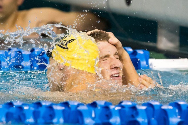 Ryan Murphy of Cal, the 100 backstroke winner, is congratulated by teammate Tony Cox who placed seventh at the 2014 NCAA Division I Swimming and Diving Championships. (courtesy of Tim Binning, theswimpictues)