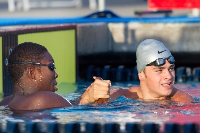 Reece Whitley shares some love with Michael Andrew, the swimmer whose National Age Group Record he broke. Andrew was 2nd in the B-Final.