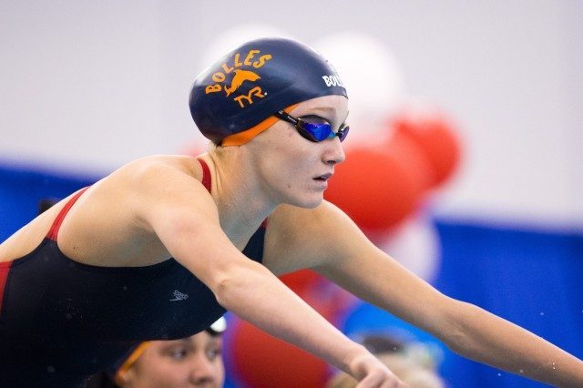 Didn't think a Shark could climb up on a block? Bolles Sharks like McKenna Debeever have somehow mastered walking on their tails. (Courtesy: Tim Binning/TheSwimPictures.com)