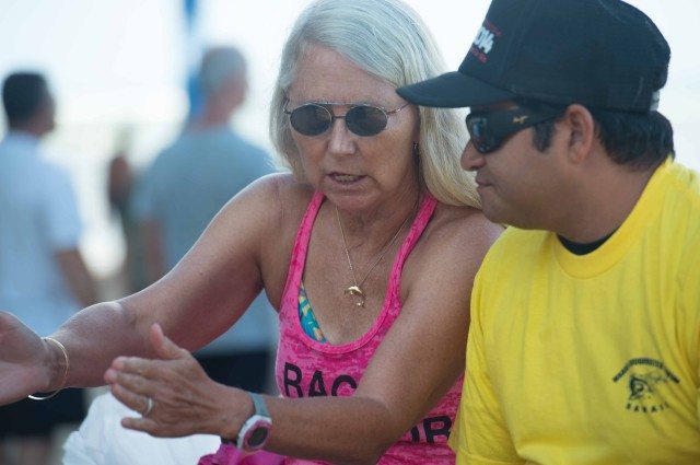 Kaia Hedlund reviews race protocol with officials (photo: Mike Lewis, Ola Vista Photography)