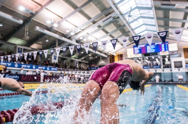 Michael Andrew off the blocks in the 100 back prelims (photo: Mike Lewis, Ola Vista Photography)