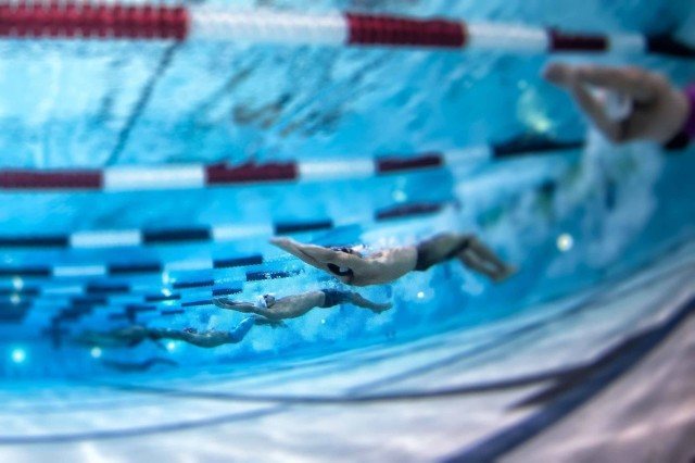 This shot was made with my camera mounted at the bottom of the pool during the USA Swimming summer nationals. The camera is placed in a protective housing made by Aquatech and fired remotely using a cable that runs up to the deck. I did some trial and error shots during the break when we did the set up to find the best location for the camera rig. (photo: Mike Lewis, Ola Vista Photography)