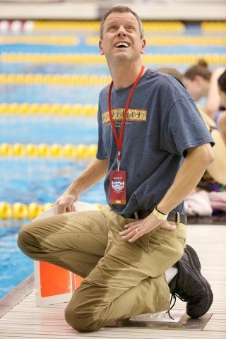 "Dedication" - A swim-dad who got really wet counting for his daughter’s 1650 swim (courtesy of rafael domeyko, rafaeldomeyko.com)