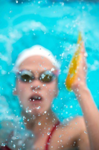 I made this shot while I was waiting to get in the water with the Victoria Swimming Academy during their training camp in Southern California. I was watching the swimmers come off the wall during their turns and noticed the way the water drops were catching the light. I decided to experiment with a very narrow depth of field to capture this shot of Canadian Olympian Hilary Caldwell