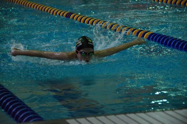 Eleanor McMeen, 11 of La Grange practices her butterfly during warm-ups prior to the Lyons Aquatics County Line Classic home meet Feb 14.