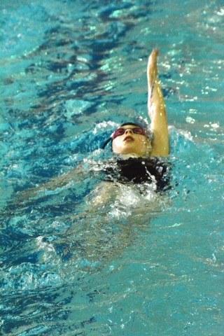 Samantha Chopp 10 of Lyons Aquatics is focused intently on her backstroke during warm-ups at the Lyons Aquatics County Line CLassic swim meet on Feb 14.