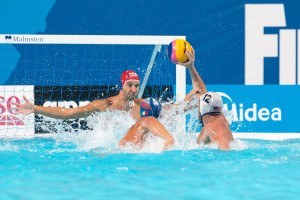 John Mann of the U.S.A scores against Italy in the final game of the water polo preliminary competition at the 2015 FINA World Championships held in Kazan, Russia.