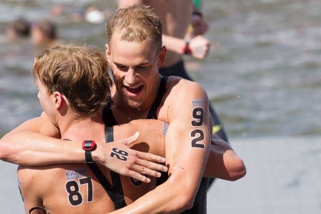 Canadian Richard Weinberger who finished 8th congratulates Jordan (courtesy of Tim Binning/TheSwimPictures.com)