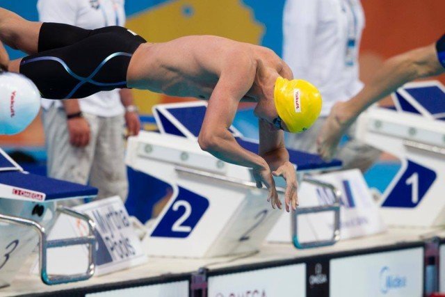 Australia's speedster Cameron McEvoy leaps into the men's 100 freestyle prelims