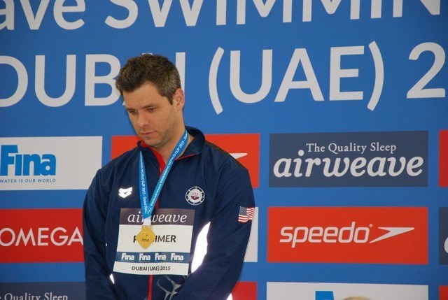David Plummer on the podium as co-gold medalist in 50m backstroke