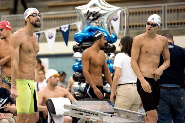 Michael Phelps and Michael Andrew side by side in the prelims of the 100 backstroke (photo: Mike Lewis)