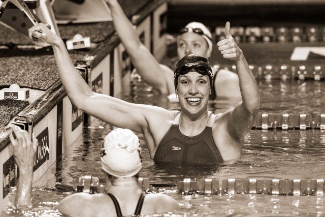 Courtney Bartholomew takes the win and the American record in the 100 backstroke (photo: Mike Lewis)