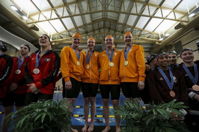 Faith Johnson of the Tennessee Volunteers, Harper Bruens of the Tennessee Volunteers, Kira Toussaint of the Tennessee Volunteers and Madeline Banic of the Tennessee Volunteers during day 2 of SEC Swimming and Diving Championships at the University of Missouri Mizzou Aquatic Center in Columbia, MO. Photo By Craig Bisacre/Tennessee Athletics