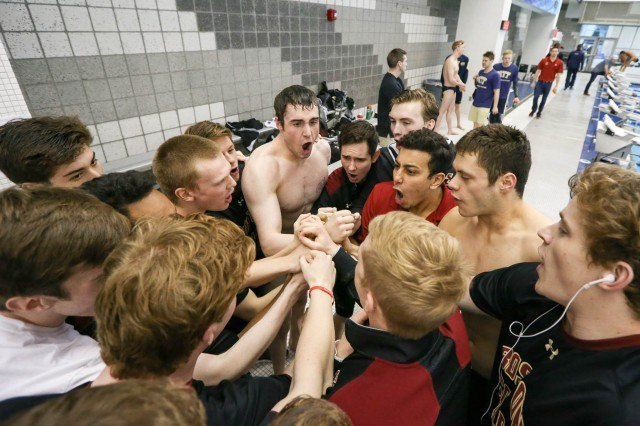 Boston College swimmers perform a team cheer before the start of finals on night two of the 2016 ACC Men's Swimming and Diving Championships held at the Greensboro Aquatic Center in Greensboro, NC February 24-27, 2016. (Courtesy: Tim Binning/TheSwimPictures.com)