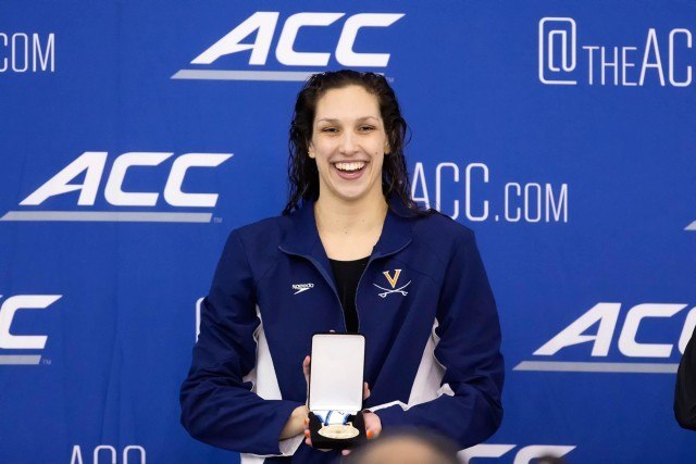 University of Virginia Senior Courtney Bartholomew is awarded the gold medal after winning the 200 individual medley in 1:55.63 at the 2016 ACC Women’s Swimming & Diving Championships held at the Greensboro Aquatic Center in Greensboro, NC from February 17 to February 20. (Photo Courtesy: Tim Binning/TheSwimPictures.com)
