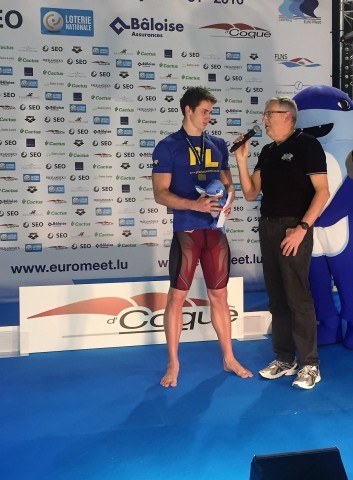 Georges Kiehl interviews Ben Proud after the50 m fly victory ceremony.