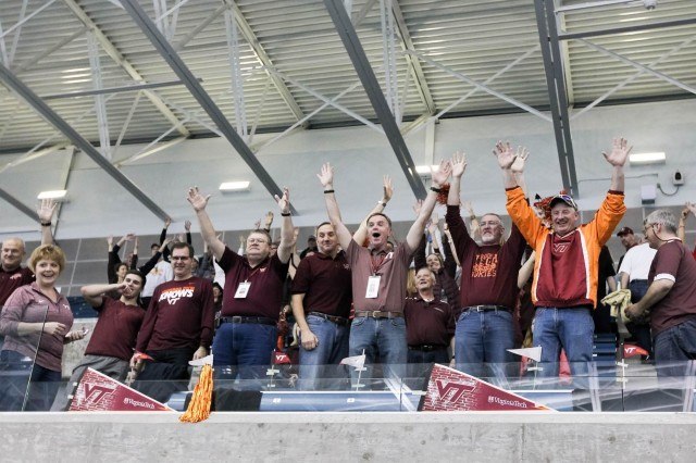 Virginia Tech parents enthusiastically cheer during the t-shirt toss before the start of finals on day 3 of the 2016 ACC Men's Swimming and Diving Championships. (Courtesy: Tim Binning/TheSwimPictures.com)