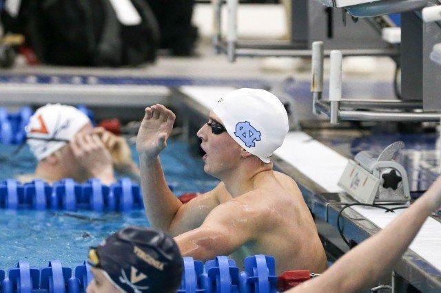 UNC Senior William Deforest flashes the school hand gesture to the team after winning the 500 free C-final at the 2016 ACC Men's Swimming and Diving Championships held at the Greensboro Aquatic Center in Greensboro, NC February 24-27, 2016. (Courtesy: Tim Binning/TheSwimPictures.com)