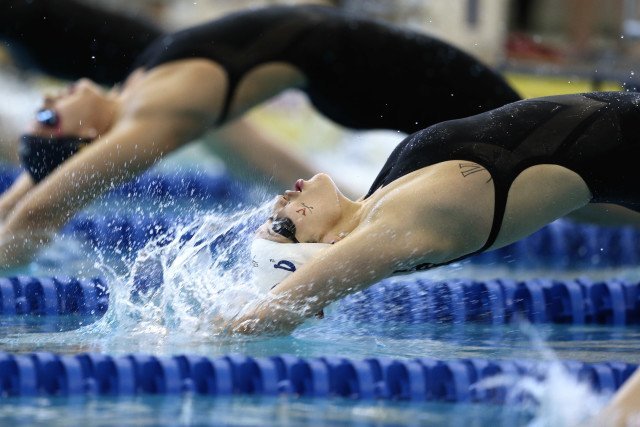 Courtney Bartholomew's backstroke entry, caught in the moment. Photo Credits: Tim Binning/TheSwimPictures.com