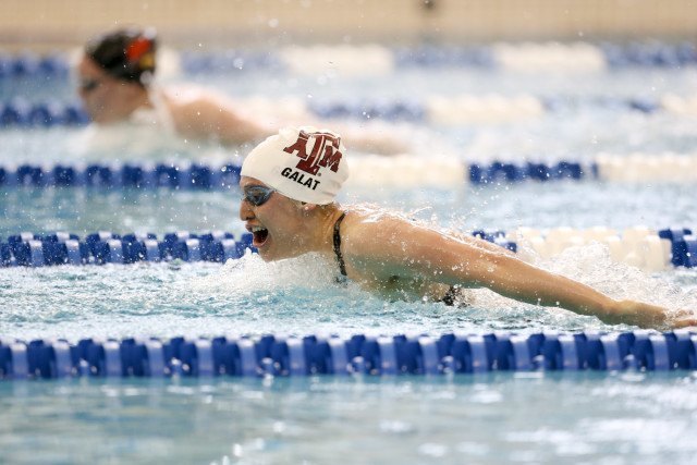 Aggie sophomore, Bethany Galat, catching a breath swimming butterfly. Photo Credits: Tim Binning/TheSwimPictures.com