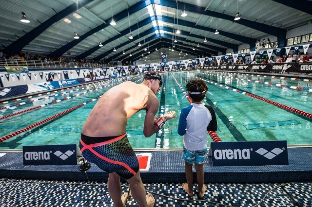 Michael Andrew joins relay with local YMCA swimmers in Orlando (photo: Mike Lewis)