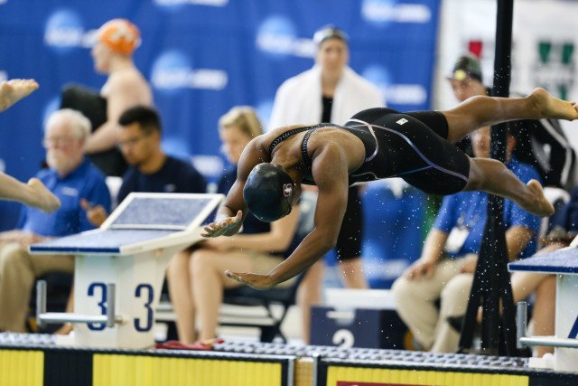 Stanford Olympian, Lia Neal, launching off the blocks for the 100 free. Photo Credits: Tim Binning/TheSwimPictures.com